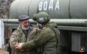 Russian peacekeepers deliver water to residents of Askeran
