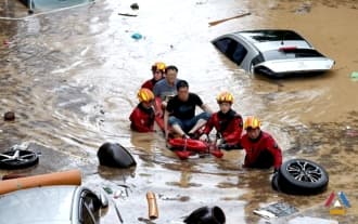 Historic rainfall turns South Korea's roads into rivers